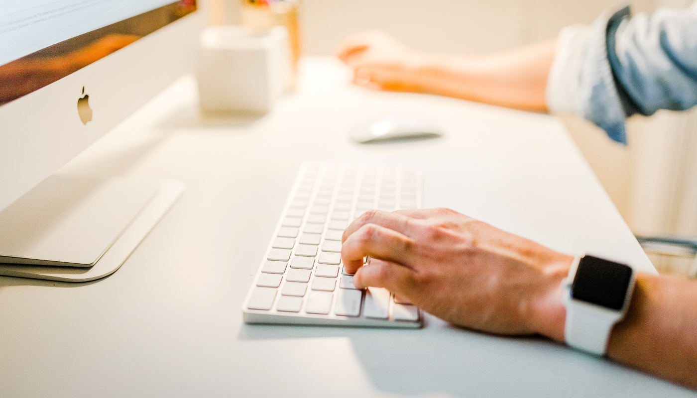 man seated at computer trying to see if his business is at risk for rental scams